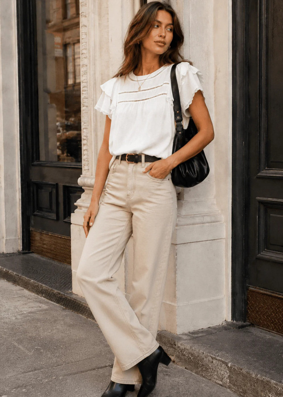 WOMEN'S SHORT RUFFLE
SLEEVE SWISS DETAILED
BLOUSE