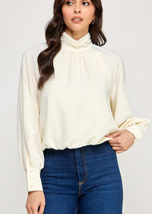 LSLV HIGH NECK BUBBLE HEM TOP | COLOR CREMA