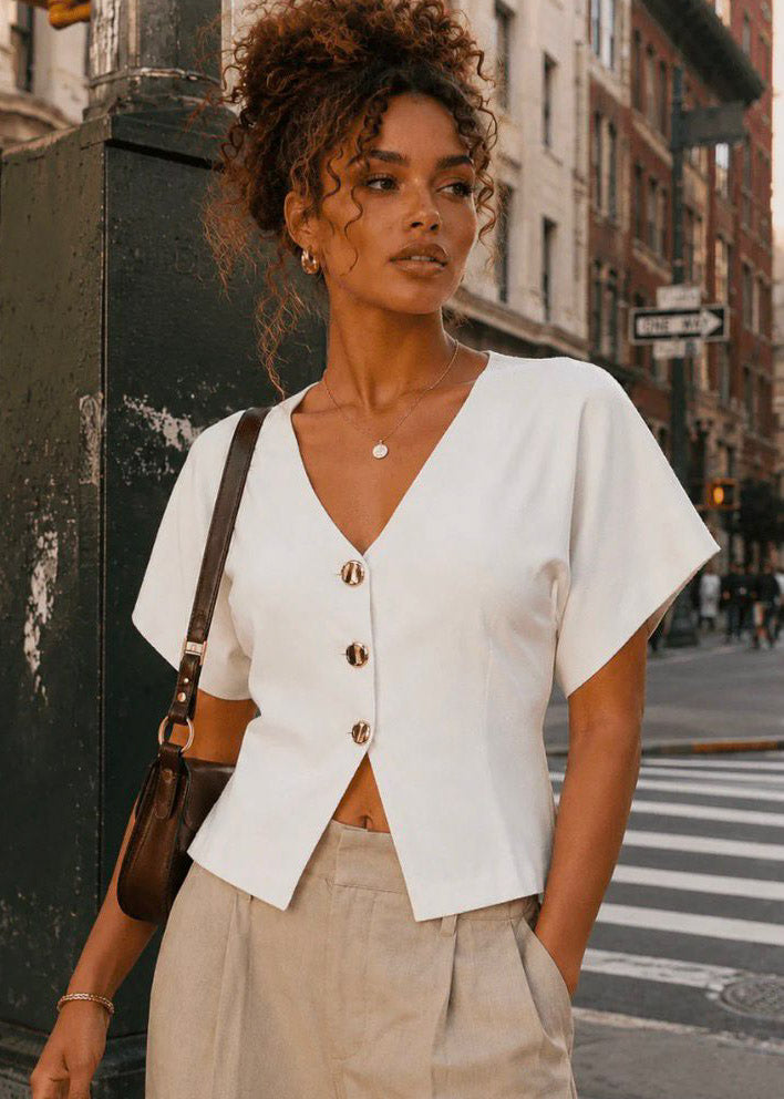 COLOR BLANCO | WOMEN'S SHORT SLEEVE V-
NECK BUTTON UP RIBBED
BLOUSE